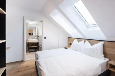 Ein Bett oder Betten in einem Zimmer der Unterkunft Moxn Apartment Lungau - Small Penthouse mit Terrasse