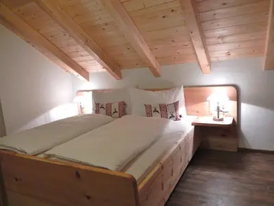 Ein Bett oder Betten in einem Zimmer der Unterkunft AlpenChalet Mitterberg