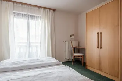 Ein Bett oder Betten in einem Zimmer der Unterkunft M-House FLACHAU Ganzes Haus für 8 Personen