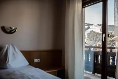 Ein Bett oder Betten in einem Zimmer der Unterkunft M-House FLACHAU Ganzes Haus für 8 Personen