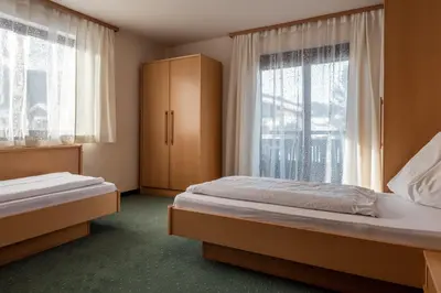 Ein Bett oder Betten in einem Zimmer der Unterkunft M-House FLACHAU Ganzes Haus für 8 Personen