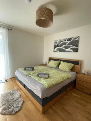 Ein Bett oder Betten in einem Zimmer der Unterkunft Albarosa Appartemant