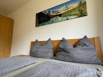 Ein Bett oder Betten in einem Zimmer der Unterkunft Ferienwohnung an der Traun