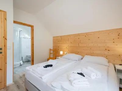 Ein Bett oder Betten in einem Zimmer der Unterkunft Wolfgangchalet C