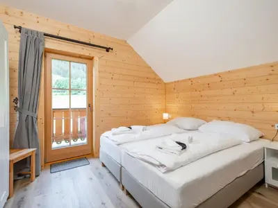 Ein Bett oder Betten in einem Zimmer der Unterkunft Wolfgangchalet C