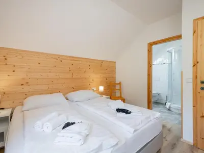 Ein Bett oder Betten in einem Zimmer der Unterkunft Wolfgangchalet B