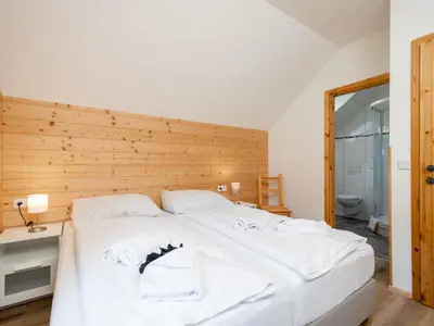 Ein Bett oder Betten in einem Zimmer der Unterkunft Wolfgangchalet A