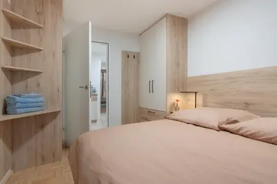 Ein Bett oder Betten in einem Zimmer der Unterkunft Modern Apartment, Full Kitchen, for 6