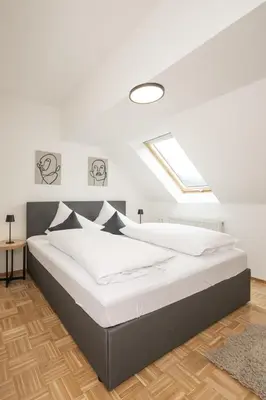 Ein Bett oder Betten in einem Zimmer der Unterkunft Centro 7 - Kristall Lungau