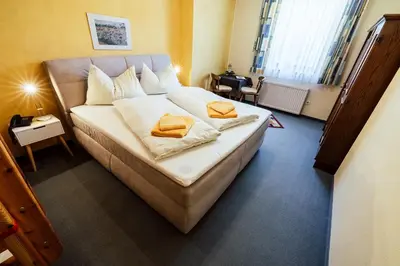 Ein Bett oder Betten in einem Zimmer der Unterkunft Landgasthof Zum Hammerschmied
