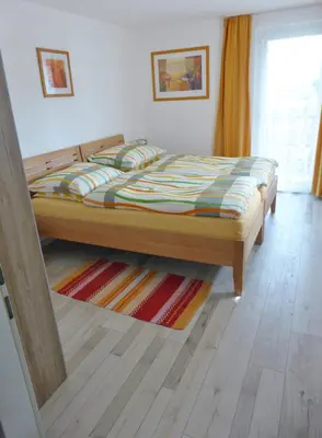 Ein Bett oder Betten in einem Zimmer der Unterkunft Ferienwohnung Sailer