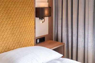 Ein Bett oder Betten in einem Zimmer der Unterkunft Hotel Traunfall