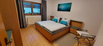 Ein Bett oder Betten in einem Zimmer der Unterkunft Ferienwohnung Seeberg mit Almfeeling