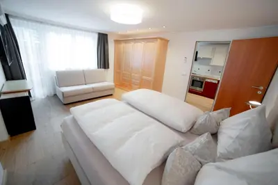 Ein Bett oder Betten in einem Zimmer der Unterkunft Aparthotel Steger Wagrain