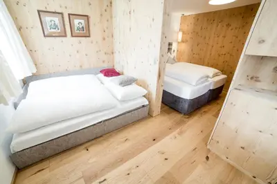 Ein Bett oder Betten in einem Zimmer der Unterkunft Aparthotel Steger Wagrain