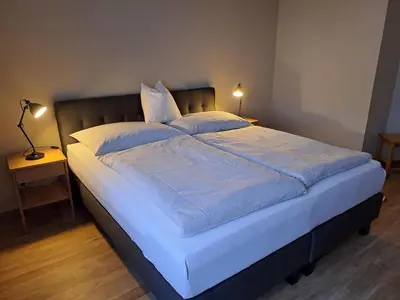 Ein Bett oder Betten in einem Zimmer der Unterkunft Haus Margrit Ferienwohnung in Sonnenlage