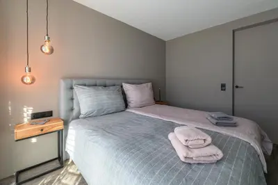 Ein Bett oder Betten in einem Zimmer der Unterkunft Dachsteinwest, Ski-in Ski-out Luxury Apartment, Free Parkplatz