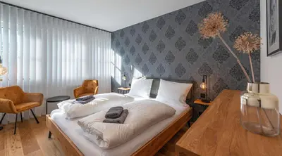 Ein Bett oder Betten in einem Zimmer der Unterkunft Apartment am Grundlsee - Your Austrian Home
