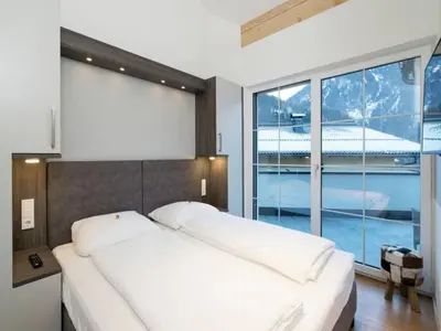 Ein Bett oder Betten in einem Zimmer der Unterkunft Penthouse Alpendorf