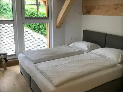 Ein Bett oder Betten in einem Zimmer der Unterkunft Penthouse Alpendorf