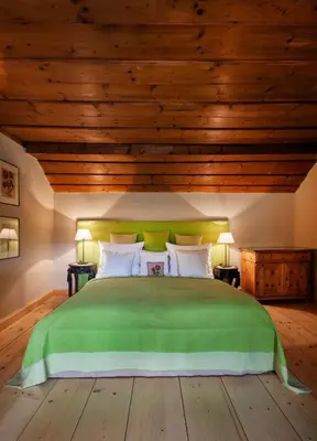 Ein Bett oder Betten in einem Zimmer der Unterkunft Garden Cottage Villa Lichtenstein - Your Austrian Home