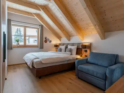 Ein Bett oder Betten in einem Zimmer der Unterkunft Alpenjoy Lodge