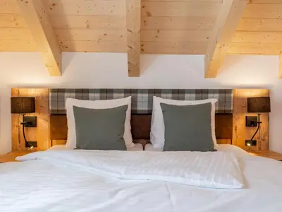 Ein Bett oder Betten in einem Zimmer der Unterkunft Alpenjoy Lodge