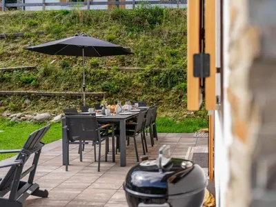 Ein Garten an der Unterkunft Alpenjoy Lodge