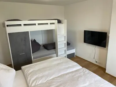 Ein Bett oder Betten in einem Zimmer der Unterkunft Wohnen im ehemaligen Kloster in Schörfling am Attersee