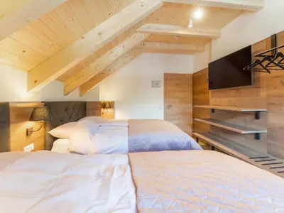 Ein Bett oder Betten in einem Zimmer der Unterkunft Ferienhaus Erna