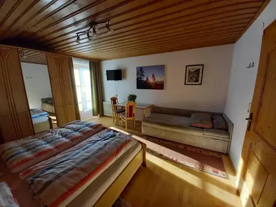 Ein Bett oder Betten in einem Zimmer der Unterkunft Vorderkreuzsaalgut Rettenwender Gertraud