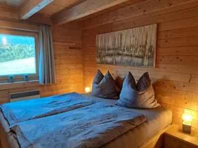 Ein Bett oder Betten in einem Zimmer der Unterkunft Gemütliches Ferienhaus mit Holzofen und Sauna