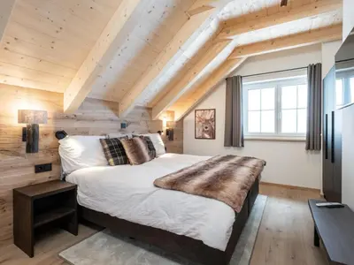 Ein Bett oder Betten in einem Zimmer der Unterkunft Edelweiss Lodge