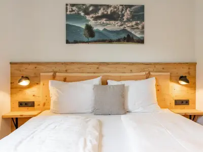 Ein Bett oder Betten in einem Zimmer der Unterkunft AlmApARTment Mauterndorf Pichl 8-1