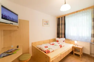 Ein Bett oder Betten in einem Zimmer der Unterkunft Haus Moser