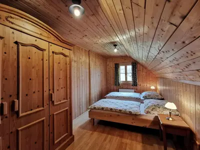 Ein Bett oder Betten in einem Zimmer der Unterkunft Ferienhaus Rosl am Grundlsee