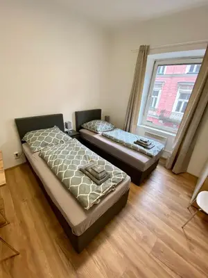 Ein Bett oder Betten in einem Zimmer der Unterkunft Apartment Loser im Zentrum