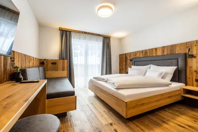 Ein Bett oder Betten in einem Zimmer der Unterkunft Gästehaus Mirzl