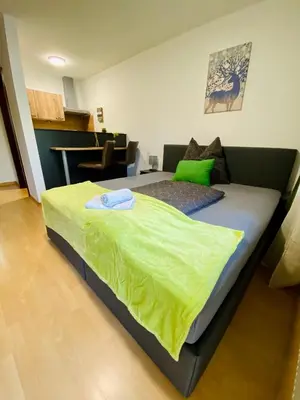 Ein Bett oder Betten in einem Zimmer der Unterkunft Apartment Dachstein nahe Zentrum