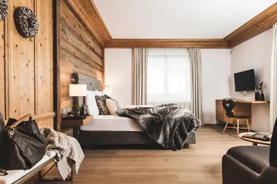 Ein Bett oder Betten in einem Zimmer der Unterkunft Alpines Gourmet Hotel Montanara