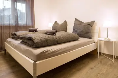 Ein Bett oder Betten in einem Zimmer der Unterkunft Apartment Schafbergblick mit Balkon