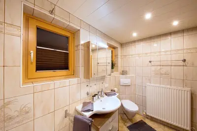 Ein Badezimmer in der Unterkunft Apartment Schafbergblick mit Balkon