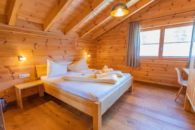 Ein Bett oder Betten in einem Zimmer der Unterkunft Chalet Huber by Alpenidyll Apartments