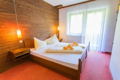 Ein Bett oder Betten in einem Zimmer der Unterkunft Huberhof 4 by Alpenidyll Apartments