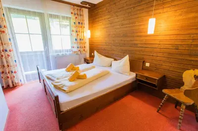 Ein Bett oder Betten in einem Zimmer der Unterkunft Huberhof 7 by Alpenidyll Apartments