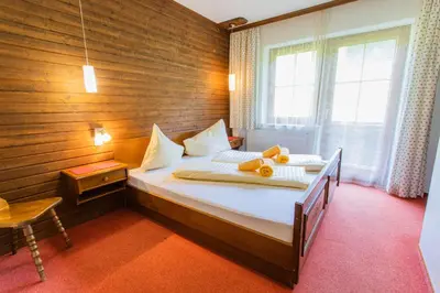 Ein Bett oder Betten in einem Zimmer der Unterkunft Huberhof 8 by Alpenidyll Apartments