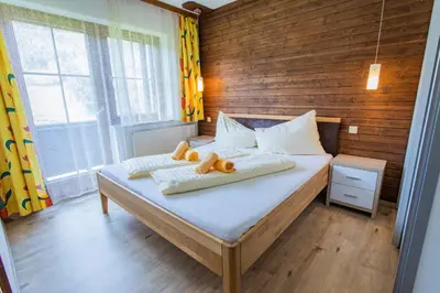 Ein Bett oder Betten in einem Zimmer der Unterkunft Huberhof 9 by Alpenidyll Apartments
