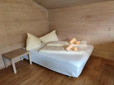 Ein Bett oder Betten in einem Zimmer der Unterkunft Huberhof 9 by Alpenidyll Apartments