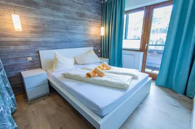 Ein Bett oder Betten in einem Zimmer der Unterkunft Huberhof 10 by Alpenidyll Apartments