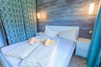 Ein Bett oder Betten in einem Zimmer der Unterkunft Huberhof 10 by Alpenidyll Apartments